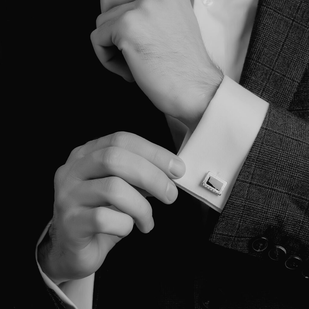 Fine garment details and tailored cuff prepared for luxury dry cleaning by Sudsies