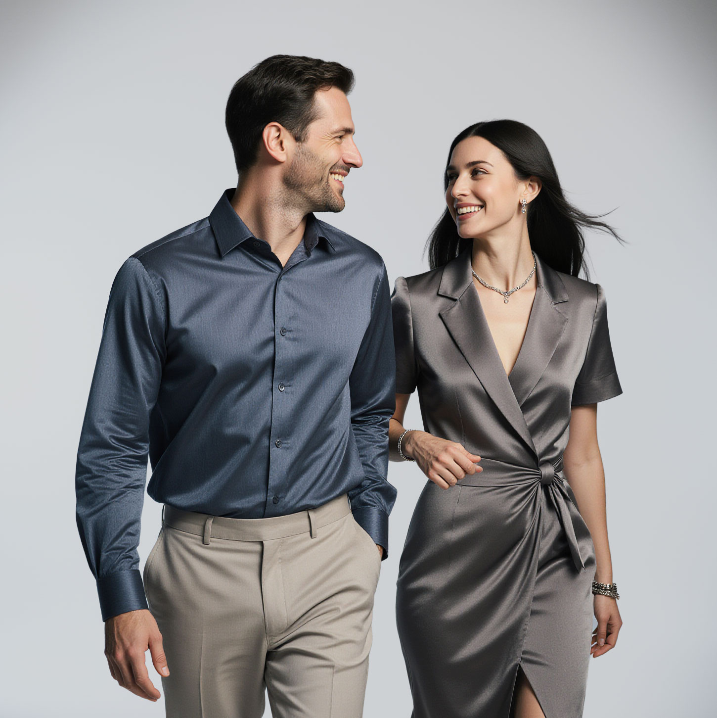 Elegant couple wearing designer garments professionally cared for by Sudsies Dry Cleaning in Weston