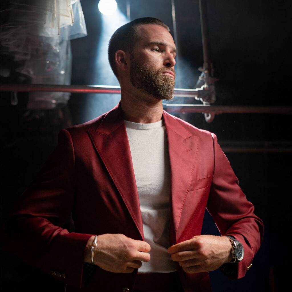 Red designer blazer professionally cleaned by Sudsies Dry Cleaning